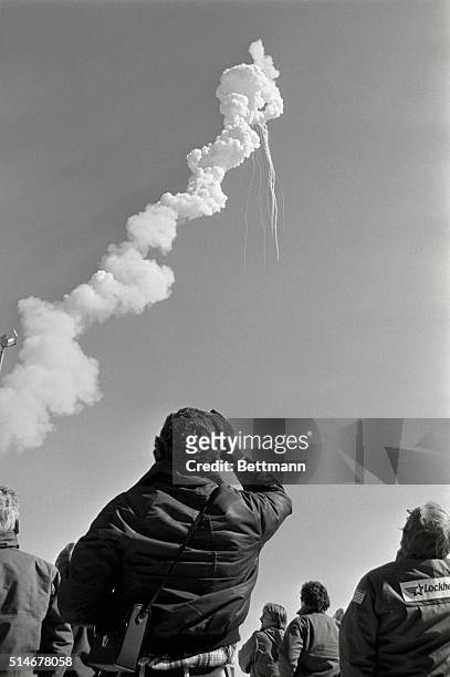 Trail of smoke leads up into the sky and then ends where the Space Shuttle Challenger exploded 73 seconds after liftoff on January 28, 1986. All...