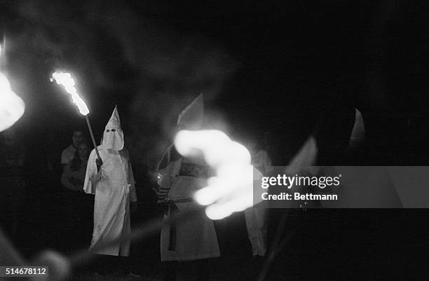 Group of Ku Klux Klansmen start burning a cross in East Windsor, Connecticut.