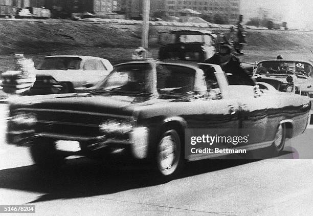 The car carrying President John F. Kennedy rushes to the nearest hospital after he was shot in Dallas.