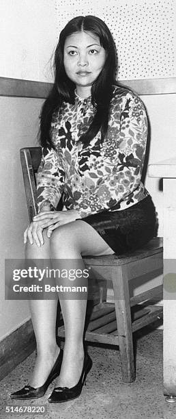 The woman with Sam Cooke before his murder, Elisa Boyer, waits for questioning at police headquarters in Los Angeles.