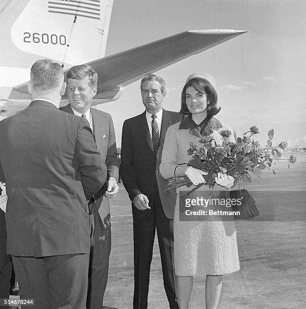 President Kennedy stands on a Texas airstrip with Jackie Kennedy and Governor John Connally on November 22, 1963. Later that day, both the president...
