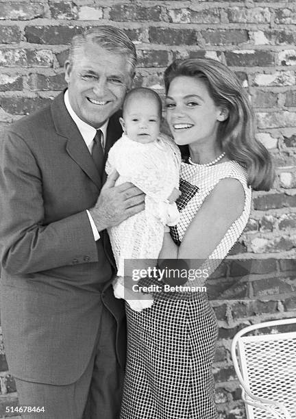 Cary Grant, wife Dyan Cannon, and their daughter Jennifer, age 3 months old, just before boarding the SS Oriana, bound for England, to visit Grant's...