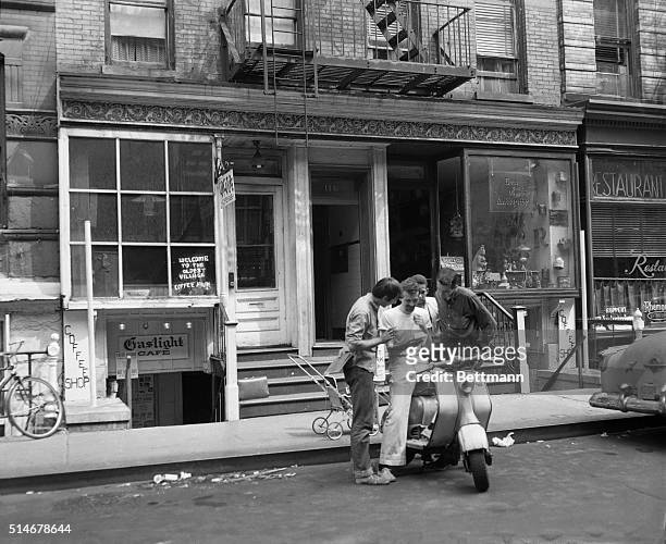 June 1959-New York, NY: Conferring in front of the "Gaslight Cafe" here are : Bob Lubin, the cafe's poetry director; co-owner John Mitchell; waiter...