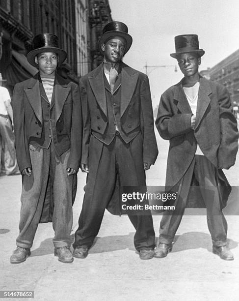 Walker Roberts Henry Campbell and Morris Jackson show off their new "zoot suits" - tuxedos looted from a formalwear shop during the Harlem riot of...