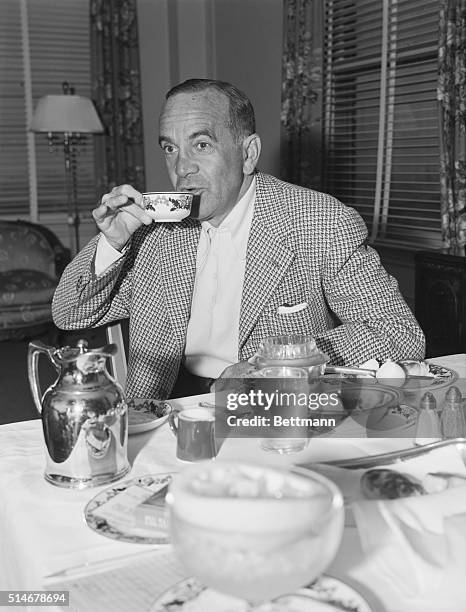 Entertainer Al Jolson eats his breakfast in the Beverly Wilshire Hotel.