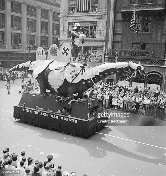 New York, NY: Anti-Nazi demonstration on Fifth Avenue and 42nd Street in 1942. "Hitler the Axis War Monster" float. Photograph.