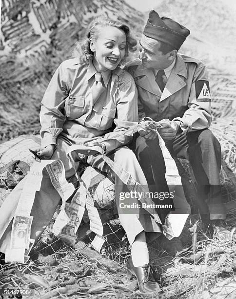 Italy: It's 1944 somewhere in Italy. Dressed in Army garb are two of the people who spent a great deal of their time entertaining U.S. Troops abroad...