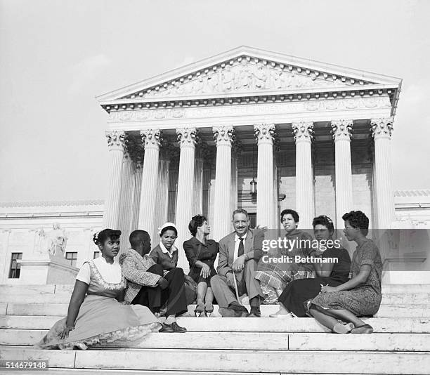 Washington: Six black children who attended Little Rock's Central High School earlier in 1958, and two NAACP officials sit outside the Supreme Court...