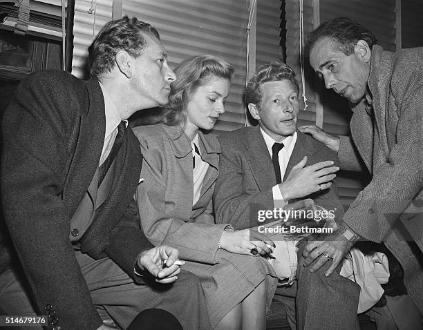 Washington, D.C.: MORE STARS DESCEND ON WASHINGTON. Filmland celebrities Paul Henried, Lauren Bacall, Danny Kaye and Humphrey Bogart are pictured at...