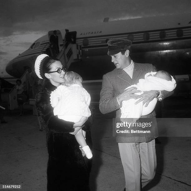 Tony Curtis and second wife Christine Kaufman land in Rome with daughters Allegra and Allessandra, where Curtis has a part in a movie. 1966.