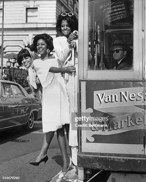 Traffic stoppers are the Supremes, America's top female vocal group, who opened at the Fairmont Hotel this past weekend. Shown hopping aboard a cable...