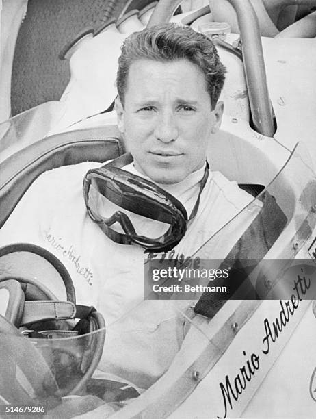 Race car driver Mario Andretti rests in his car after qualifying for the Indianapolis 500. | Location: Indianapolis Speedway, Indianapolis, Indiana,...