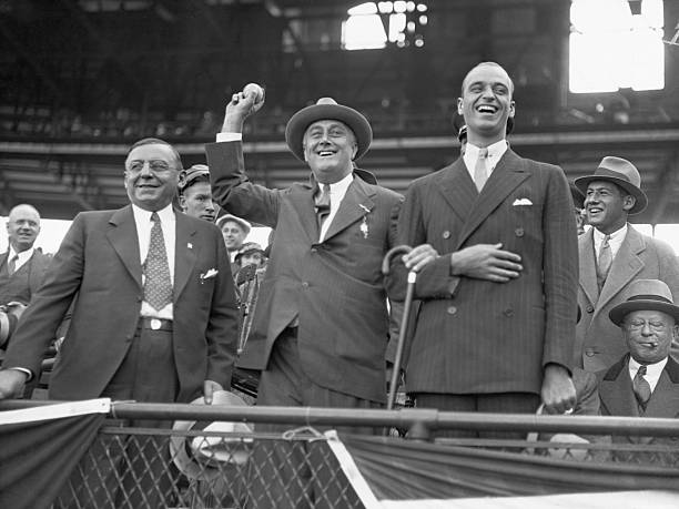 New York Governor and presidential candidate Franklin Roosevelt throws out a baseball at the last game of the 1932 World Series between the Chicago...