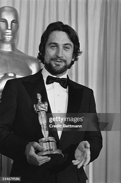 Hollywood, CA: Actor Robert De Niro, closeup, with his Oscar for "best Male Performance" in the movie "Raging Bull."