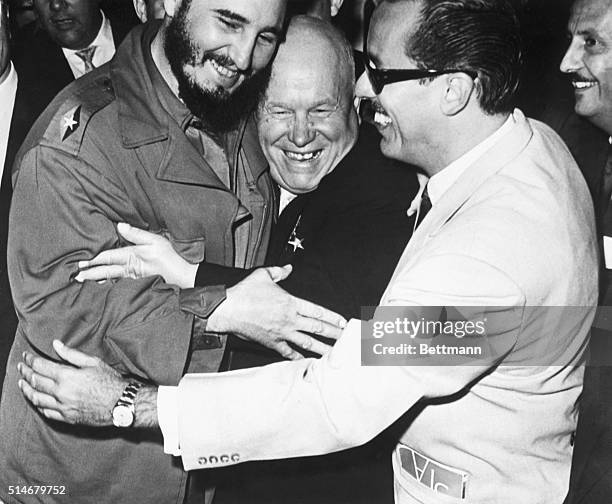 Cuban Premier Fidel Castro and Soviet Premier Nikita Khrushchev hug each other heartily when they meet at the United Nations.