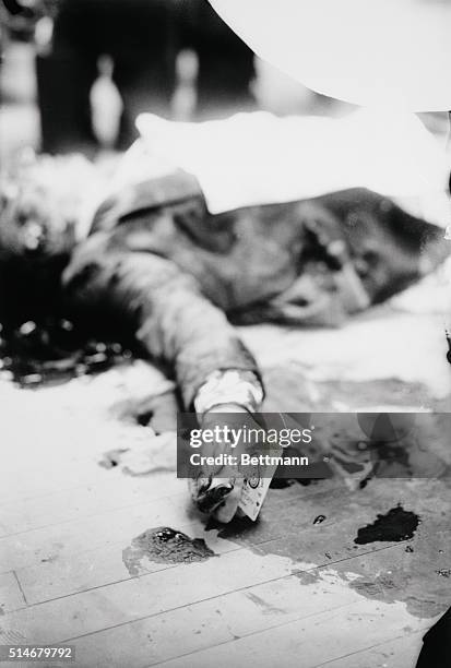The body of underworld kingpin Joe "The Boss" Masseria. He holds a playing card in his hand, as he was murdered while playing pinochle in a...