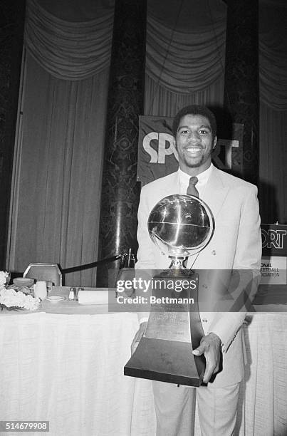 New York: Earvin "Magic" Johnson, who played guard, forward and center in his rookie year with the Lakers, shows off Sports Magazine Most Valuable...