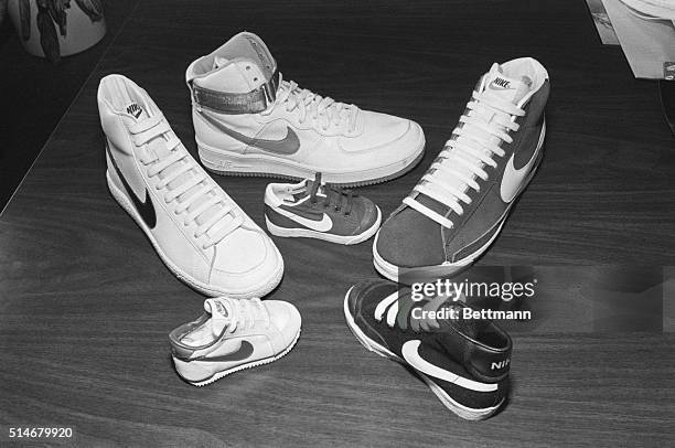 Six Nike sports shoes rest on a table at the company headquarters in Portland, Oregon for the unveiling of the 1982 Air-Force line of basketball...