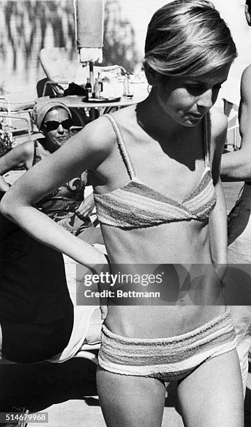 Twiggy poolside at the home of producer Charles K. Feldman. 5/27/1967