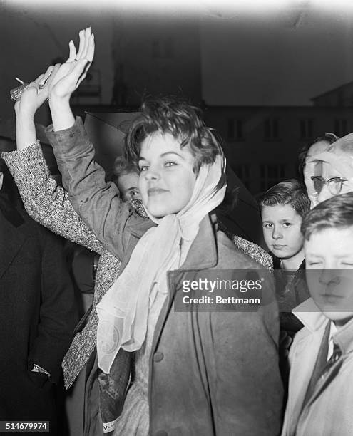 Elvis Presley's girlfriend Priscilla Beaulieu waves goodbye to Elvis as he departs from Rhine-Main air base February 2, 1960 to return to the United...