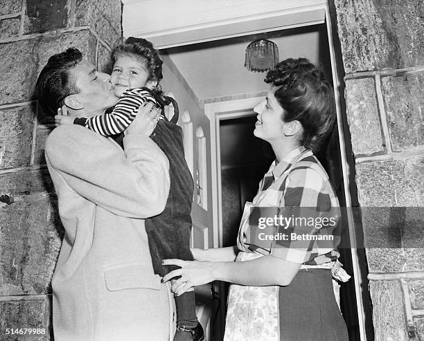 Frank Sinatra in 1944 photo with daughter, Nancy, and wife, Nancy.