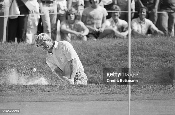 Springfield, NJ: The ball flies from the sand as Jack Nicklaus blasts his way out of the trap on the 14th hole during first round U.S. Open play here...