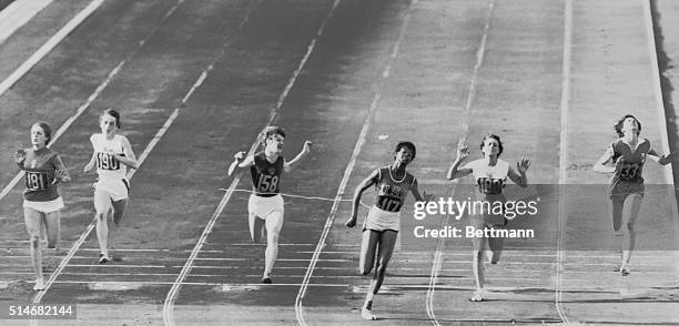 Rome, Italy: America's Wilma Rudolph breasts the tape to win the women's 100-meter dash here, Sept. 2nd. Wilma's winning time was 11seconds flat, a...