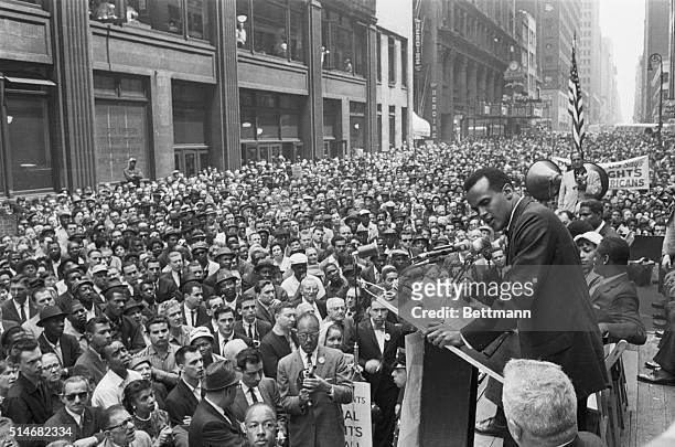 Crowd of over 10,000 civil rights marchers gathers in the Manhattan Garment Center as Harry Belafonte sings at spiritual at a civil rights rally.