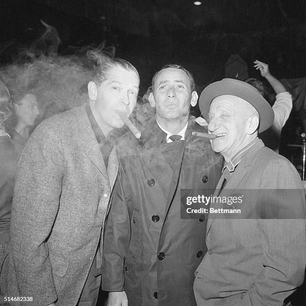 Milton Berle , Joey Bishop , and Jimmy Durante smoke cigars during a reheasal for the gala planned for John Kennedy's inauguration.