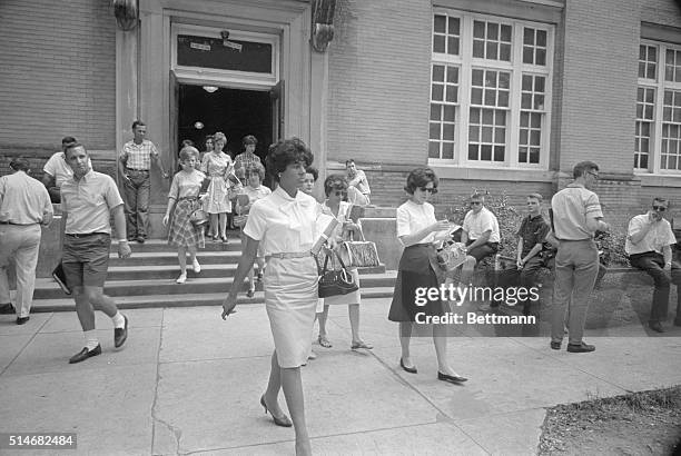 Vivian Malone, one of the first African American students to attend the University of Alabama, exits a building on campus where she attended her fist...