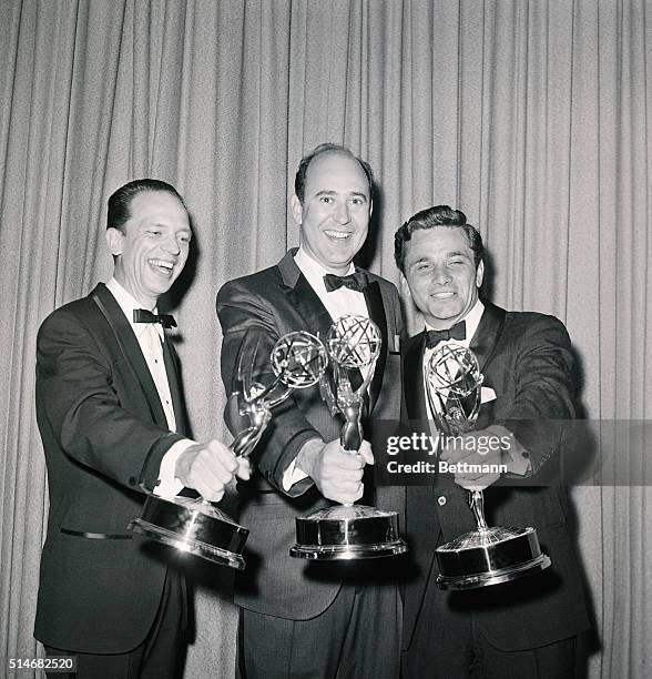 Three Emmy winners, Don Knotts, Carl Reiner, and Peter Falk, hold their awards at the 1962 Awards.