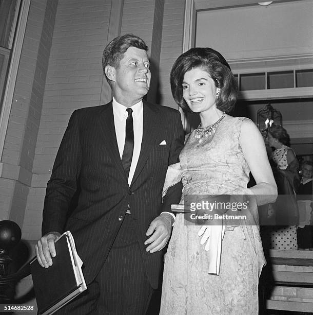 President Kennedy and wife Jackie stand together at the National Guard Armory, where attend the American Pageant of the Arts" on November 29, 1962....