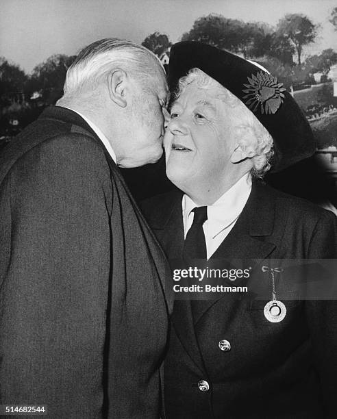 Dame Margaret Rutherford gets a kiss from her husband actor Stringer Davis at Elstree Studios, after winning the Academy Award for Best Supporting...