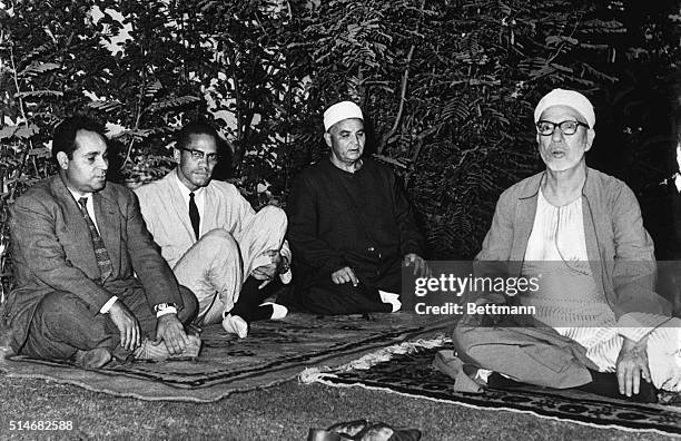 Black Muslim leader Malcolm X meets with Sheik Abdel Rahman Tag , the future rector of Al Azhar, the only Muslim University in the world.