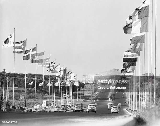 Flags from the nations participating in the 1960 Olympics wave from poles along the Via Olympica in Rome. The wide avenue leads to the Olympic Sports...
