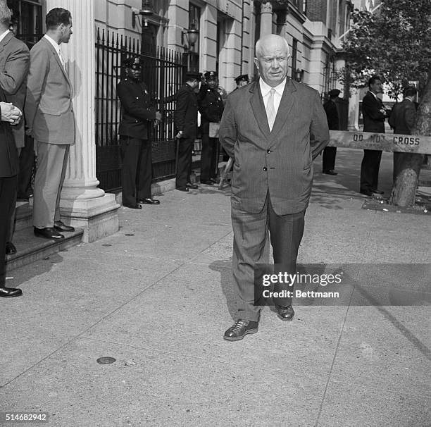 Soviet Premier Nikita Khrushchev takes a confined walk on the sidewalk in front of Soviet United Nations Headquarters in New York City. October 5,...