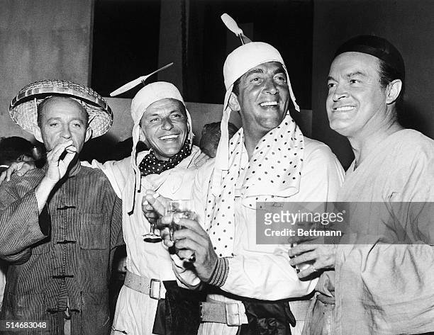 Bing Crosby, Frank Sinatra, Dean Martin, and Bob Hope fool around on the set of the 1961 film The Road to Hong Kong.