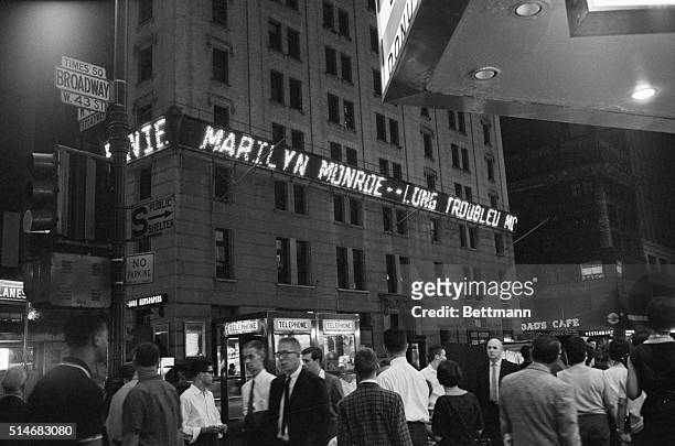 The electronic message board on the New York Times Building on Broadway announces the death of Marilyn Monroe by barbituate overdose on August 5th,...