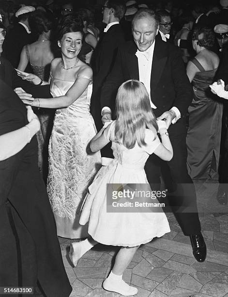 Dr. Francis Crick, of Great Britain, dances with his daughter, Gabrielle, at the Nobel Banquet where he just won the 1962 Nobel Prize in Medicine,...