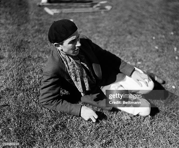 Walt Disney, the American entrepreneur, reclines on the lawn of the Riviera Country Club on June 21 and watches the polo match between the Greyhounds...