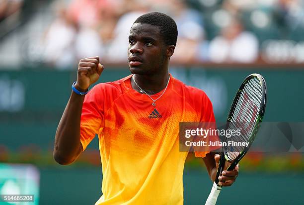 Frances Tiafoe of USA celebrates defeating Taylor Fritz of USA during day four of the BNP Paribas Open at Indian Wells Tennis Garden on March 10,...