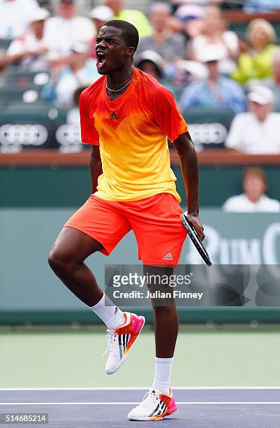 Frances Tiafoe of USA celebrates defeating Taylor Fritz of USA during day four of the BNP Paribas Open at Indian Wells Tennis Garden on March 10,...