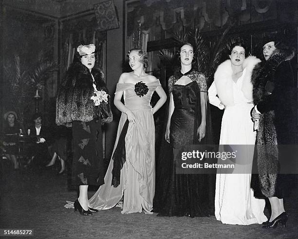 Fall and winter fashions designed by Gloria Morgan Vanderbilt, right, and her sister, Thelma Lady Furness, left, are shown being worn by models at a...