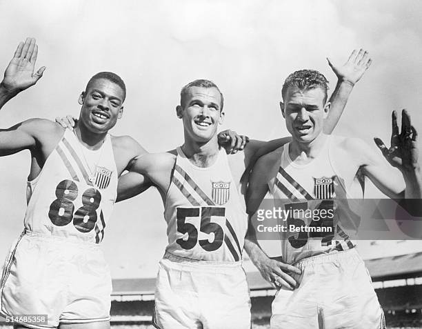 American sprinters Bobby Morrow , Andy Stanfield , and Thane Baker embrace after sweeping the men's 200-meter dash at the 1956 Summer Olympics at...