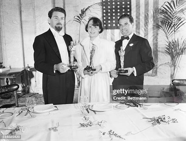 Luise Rainer, Paul Muni, And Frank Capra proudly hold their Oscars on March 6, 1937. Rainer was awarded Best Actress Oscar for her role as Anna Held...