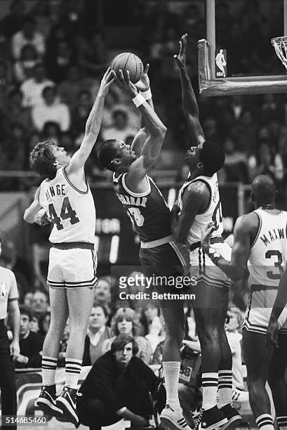 Danny Ainge and Robert Parish of the Boston Celtics attempt to block a shot by Los Angeles Lakers center Kareem Abdul-Jabber in the first quarter of...