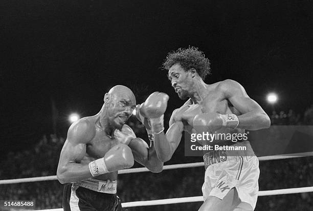 Challenger Thomas "Hit Man" Hearns strikes middleweight champion "Marvelous" Marvin Hagler with a right to the face during a boxing match in Las...