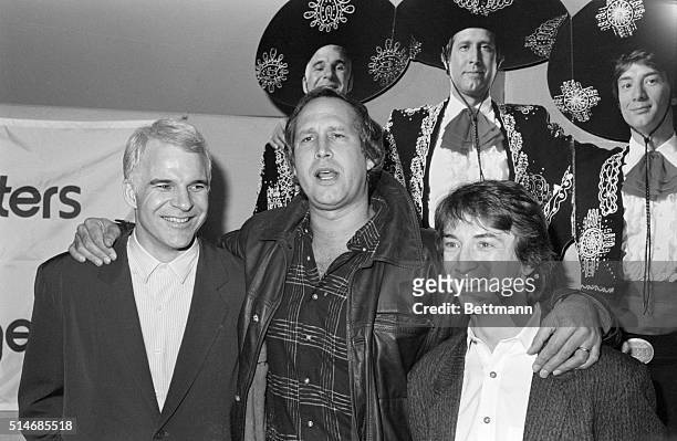Steve Martin, Chevy Chase and Martin Short stand together at the Motion Picture Academy for the premiere of their film Three Amigos, on December 10,...