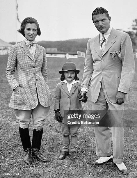 John Bouvier stands with his wife and daughter Jaqueline at the Sixth Annual Horse Show of the Southampton Riding and Hunt Club on Long Island.