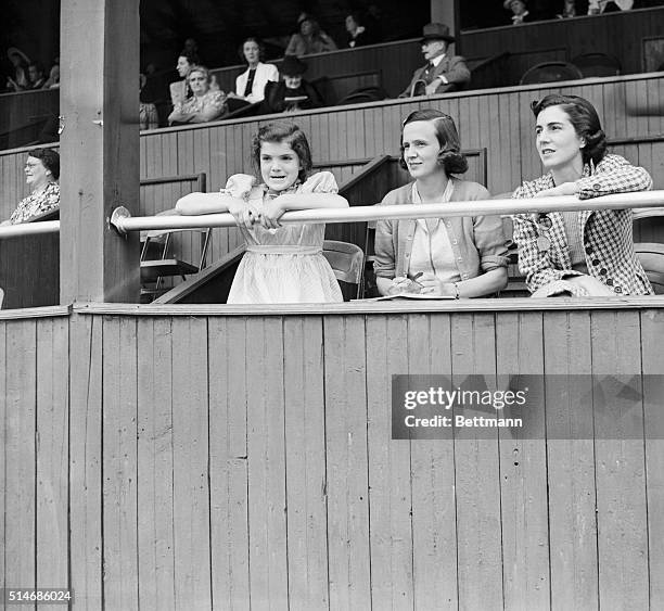 Young Jacqueline Bouvier watches the Tuxedo Horse Show with Mrs. Allen McLane and her mother Mrs. John Bouvier.